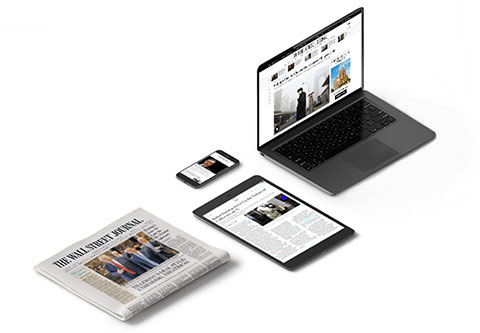 Wall Street Journal in print and on laptop